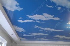 Натяжные потолки с облаками